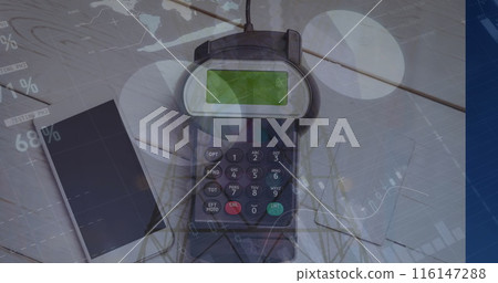 Image of graphs over hand of caucasian man holding payment terminal Image of graphs over hand of caucasian man holding payment terminal 116147288