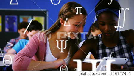 A student using a digital tablet in a classroom 116147405