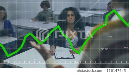 Image of green graphs moving over african american woman taking notes during a presentation Image of green graphs moving over african american woman taking notes during a presentation 116147645