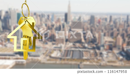 Image of gold house key and fob over out of focus cityscape 116147958