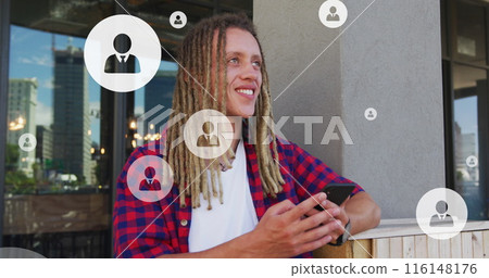 Image of profile icons in circles over smiling biracial woman scrolling on smartphones 116148176