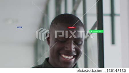 Image of social media icons and numbers over african american businessman in office 116148180