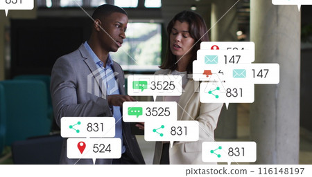 Image of social media icons and numbers over diverse business people 116148197