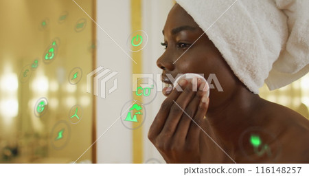 Image of icons over african american woman cleansing face in bathroom 116148257