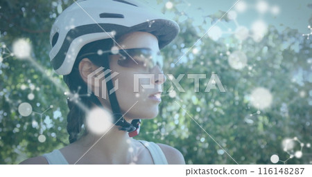 Caucasian woman wearing cycling helmet and sunglasses, thinking deeply Caucasian woman wearing cycling helmet and sunglasses, thinking deeply 116148287