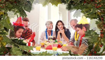 Caucasian family enjoys festive meal amid holiday decorations 116148299