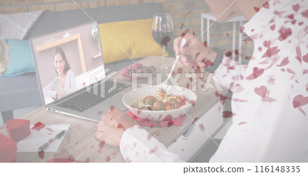 Caucasian couple enjoying virtual dinner date, male eating spaghetti Caucasian couple enjoying virtual dinner date, male eating spaghetti 116148335
