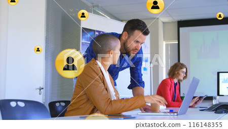 Image of profile icon in circles over diverse coworkers discussing reports on laptop at office Image of profile icon in circles over diverse coworkers discussing reports on laptop at office 116148355