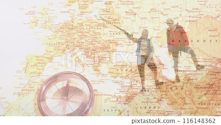 Caucasian couple exploring map of Europe and Asia, compass in foreground 116148362