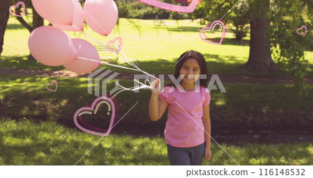 Image of pink hearts over smiling girl holding pink balloons in sunny park Image of pink hearts over smiling girl holding pink balloons in sunny park 116148532
