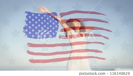 Image of american flag over african american woman raising hands at beach 116148629