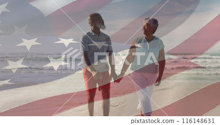 Image of flag of usa over happy senior biracial couple in love walking on beach Image of flag of usa over happy senior biracial couple in love walking on beach 116148631