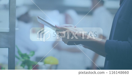 Image of social media text and icons over caucasian businessman using tablet Image of social media text and icons over caucasian businessman using tablet 116148660