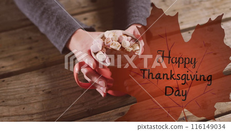 Image of happy thanksgiving day text over hands holding cocoa 116149034
