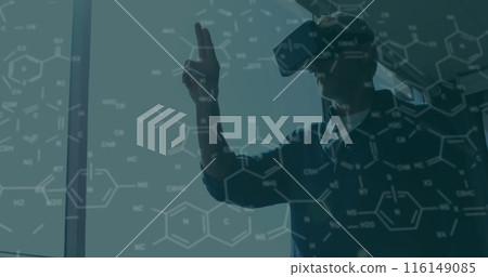 Image of chemical formulas over biracial men using vr headset 116149085