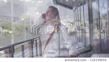 Image of cars over biracial man walking with bike and talking on smartphone Image of cars over biracial man walking with bike and talking on smartphone 116149648