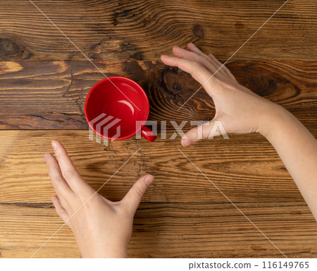 Hand Holds Cup, Empty Red Cup in Hands, Coffee Mug, Teacup, Hot Beverage Mockup Hand Holds Cup, Empty Red Cup in Hands, Coffee Mug, Teacup, Hot Beverage Mockup 116149765