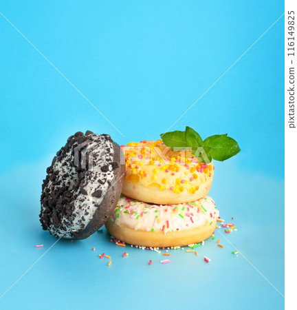 Doughnuts, Chocolate Brown and Pink Donut with Multicolored Sprinkles Doughnuts, Chocolate Brown and Pink Donut with Multicolored Sprinkles 116149825