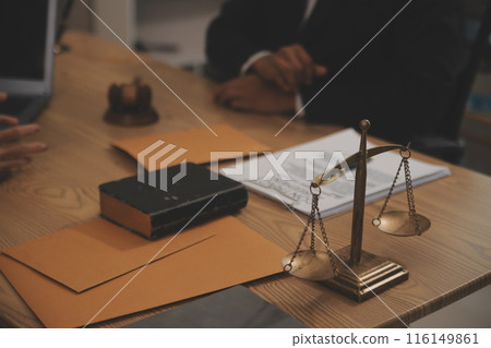 Judge gavel with Justice lawyers having team meeting at law firm background. Concepts of Law and Legal services. Judge gavel with Justice lawyers having team meeting at law firm background. Concepts of Law and Legal services. 116149861