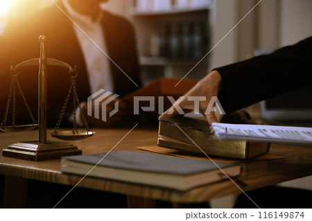Judge gavel with Justice lawyers having team meeting at law firm background. Concepts of Law and Legal services. 116149874
