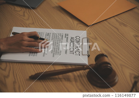 Judge gavel with Justice lawyers having team meeting at law firm background. Concepts of Law and Legal services. 116149877