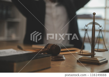 Judge gavel with Justice lawyers having team meeting at law firm background. Concepts of Law and Legal services. Judge gavel with Justice lawyers having team meeting at law firm background. Concepts of Law and Legal services. 116149888