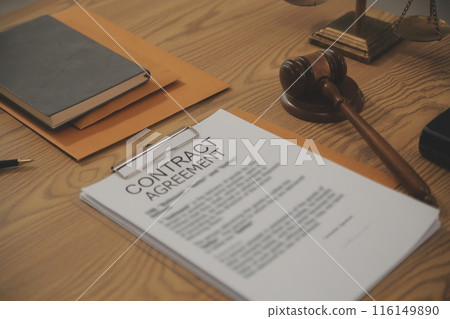 Judge gavel with Justice lawyers having team meeting at law firm background. Concepts of Law and Legal services. Judge gavel with Justice lawyers having team meeting at law firm background. Concepts of Law and Legal services. 116149890