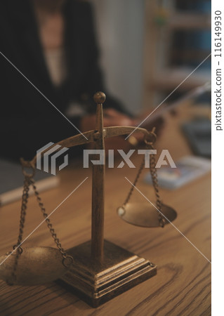 Judge gavel with Justice lawyers having team meeting at law firm background. Concepts of Law and Legal services. Judge gavel with Justice lawyers having team meeting at law firm background. Concepts of Law and Legal services. 116149930