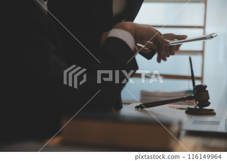 Judge gavel with Justice lawyers having team meeting at law firm background. Concepts of Law and Legal services. Judge gavel with Justice lawyers having team meeting at law firm background. Concepts of Law and Legal services. 116149964