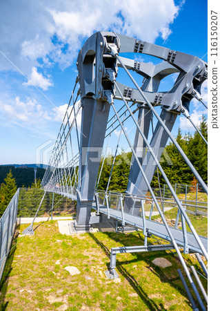 Close-up view of a sturdy steel support pillar for the Sky Bridge in Dolni Morava Resort, Czechia. The bridge is known for its impressive length and scenic views. Close-up view of a sturdy steel support pillar for the Sky Bridge in Dolni Morava Resort, Czechia. The bridge is known for its impressive length and scenic views. 116150207