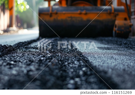Laying fresh asphalt, road work with asphalt finisher , asphalt paver rolls asphalt Laying fresh asphalt, road work with asphalt finisher , asphalt paver rolls asphalt 116151269