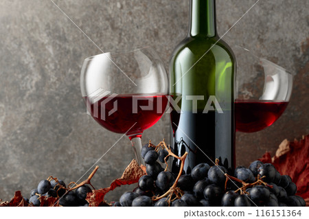 Red wine and blue grapes. Red wine and blue grapes. 116151364