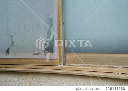 Old screen door with a hole Old screen door with a hole 116151380