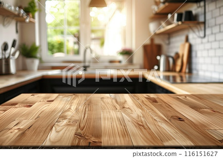Bright kitchen with a wooden countertop in focus for product montage over blurred modern light interior background, copy space, ideal for promoting kitchenware and home decor. Bright kitchen with a wooden countertop in focus for product montage over blurred modern light interior background, copy space, ideal for promoting kitchenware and home decor. 116151627