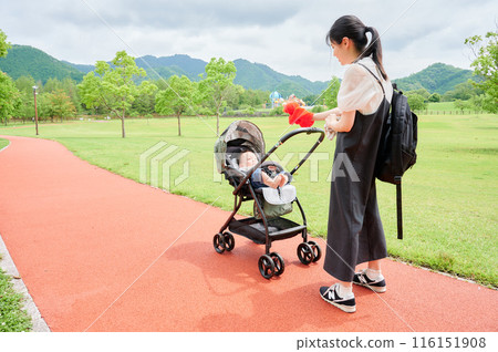 Baby in a stroller and mother childcare Baby in a stroller and mother childcare 116151908