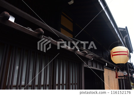 Old streetscape of Takayama city, Gifu prefecture, Japan. Lanterns displayed in front of old houses during the Takayama Festival in spring. 116152176