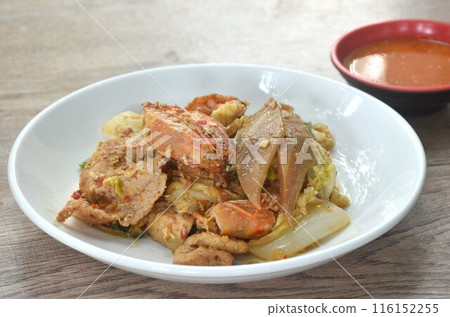 fried glass noodles chicken and pork meat couple crispy pickled squid and shrimp with vegetable on plate dipping sukiyaki sauce fried glass noodles chicken and pork meat couple crispy pickled squid and shrimp with vegetable on plate dipping sukiyaki sauce 116152255