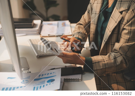 Team of business people working together in the meeting room office, teamwork background charts and graphs banner, double exposure successful teamwork,business planning concept. 116153082