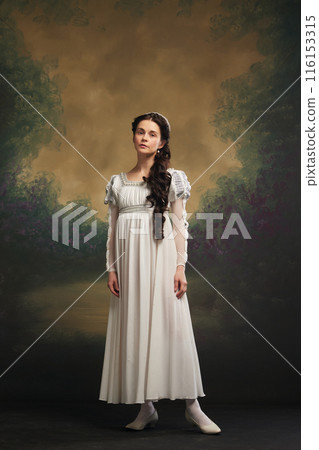 Regency elegance. Portrait of young beautiful woman, medieval princess in white dress standing against vintage background 116153315