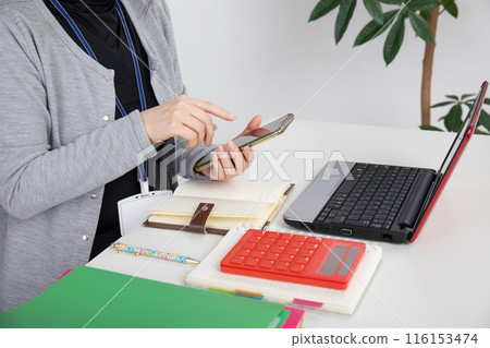 woman working on a computer woman working on a computer 116153474