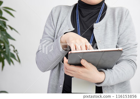 A woman with beautiful hands working A woman with beautiful hands working 116153856