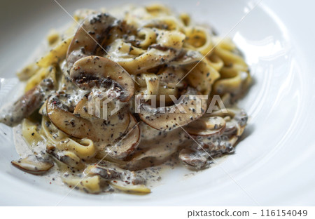 Truffle tagliatelle spaghetti, unique and earthy flavor of black truffles made simple way with pasta. Pasta plate in Argentina steakhouse restaurant. 116154049