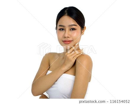 A closeup shot of young woman delicately touching her face, revealing detail of her finger, nail, and facial texture. Her eye carry an expression of deep contemplation. 116154052