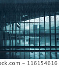 Image of rain falling on large windows of a building 116154616