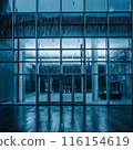 Image of rain falling on large windows of a building 116154619