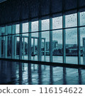 Image of rain falling on large windows of a building 116154622