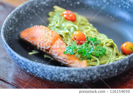 salmon pasta or pesto salmon pasta , pasta with green sauce or pesto sauce salmon pasta or pesto salmon pasta , pasta with green sauce or pesto sauce 116154650