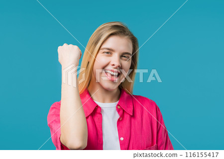 Young woman shows triumph yes gesture of victory. Glad teenager girl won, winner 116155417