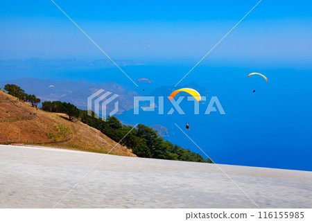 Flying paraglider at Babadag mountain in Turkey Flying paraglider at Babadag mountain in Turkey 116155985