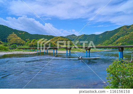 Imanari Bridge (Sada Submerged Bridge) and a small boat across the Shimanto River in Shimanto City, Kochi Prefecture 116156158
